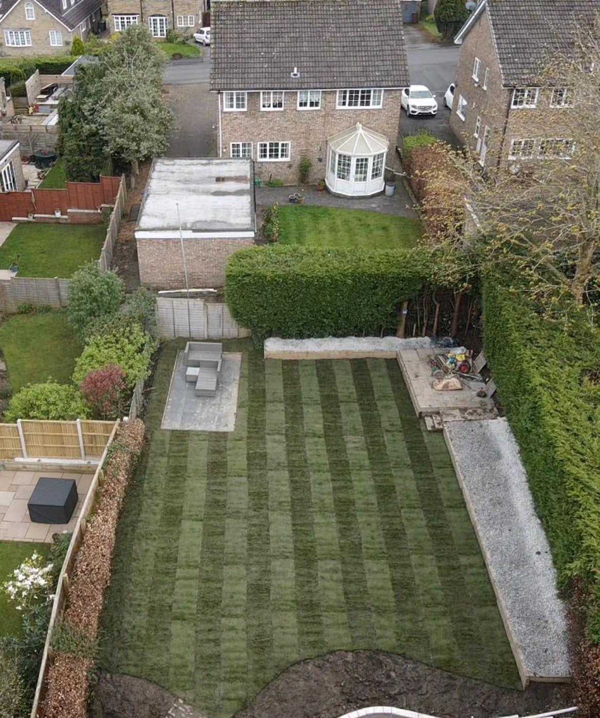 After: landscaped front garden with gravel bed and shrub planting