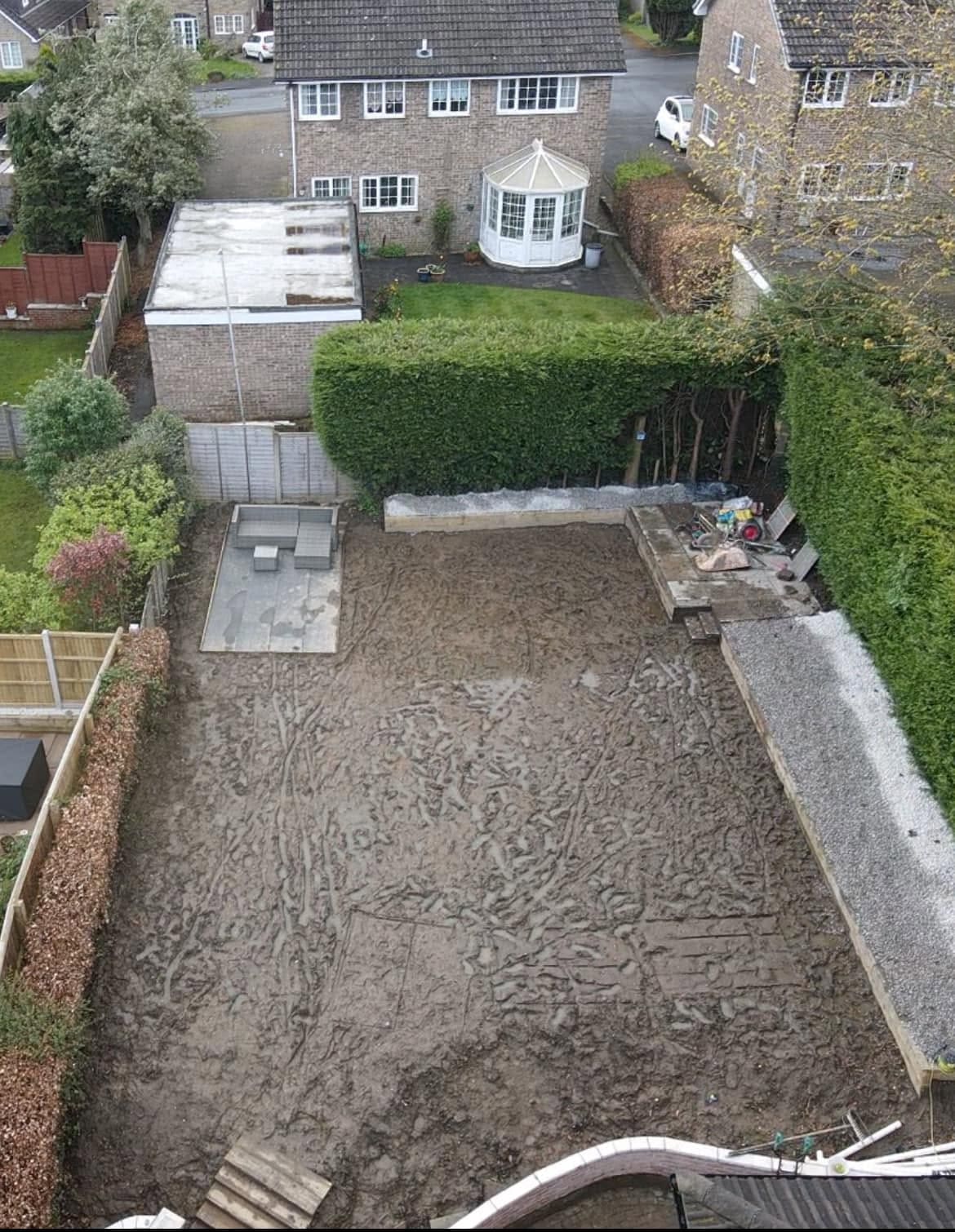 Before: unplanted front garden corner